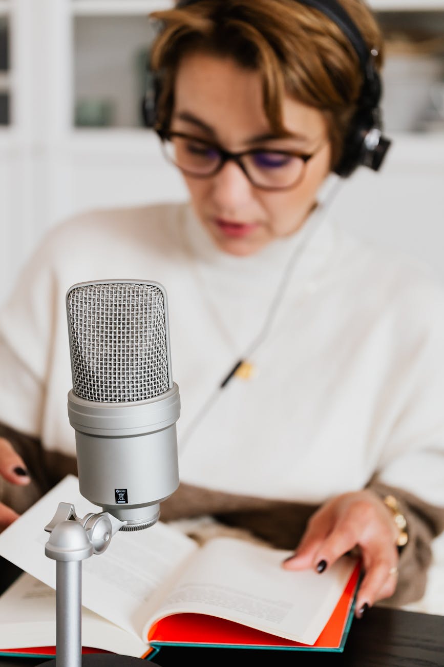 photo of condenser microphone near woman reading a book